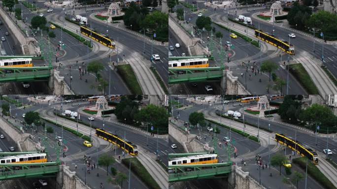 城市交通鸟瞰图。汽车和电车穿过城市的十字路口。行人和骑自行车的人过马路。匈牙利布达佩斯