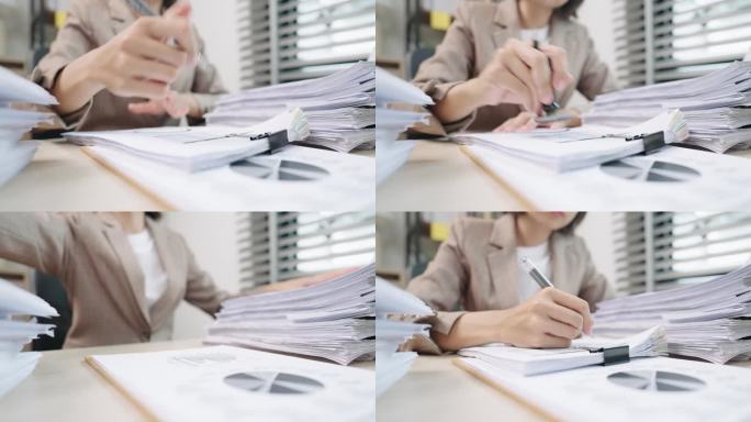 女律师或法官在法庭上做笔记的手特写，律师业务在桌子办公室工作。