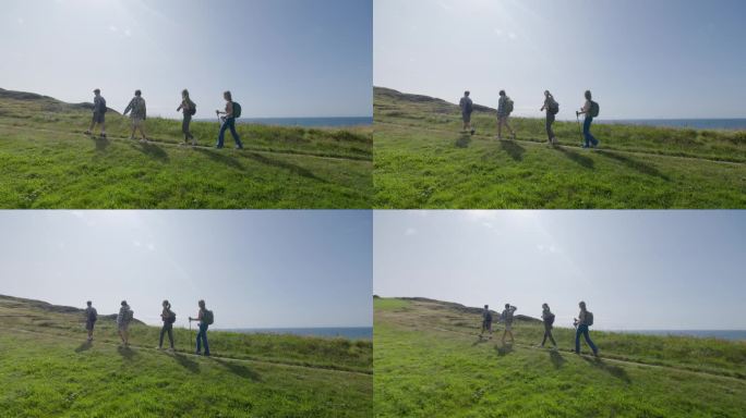 一家人在英国多塞特郡侏罗纪海岸的海边悬崖上徒步旅行