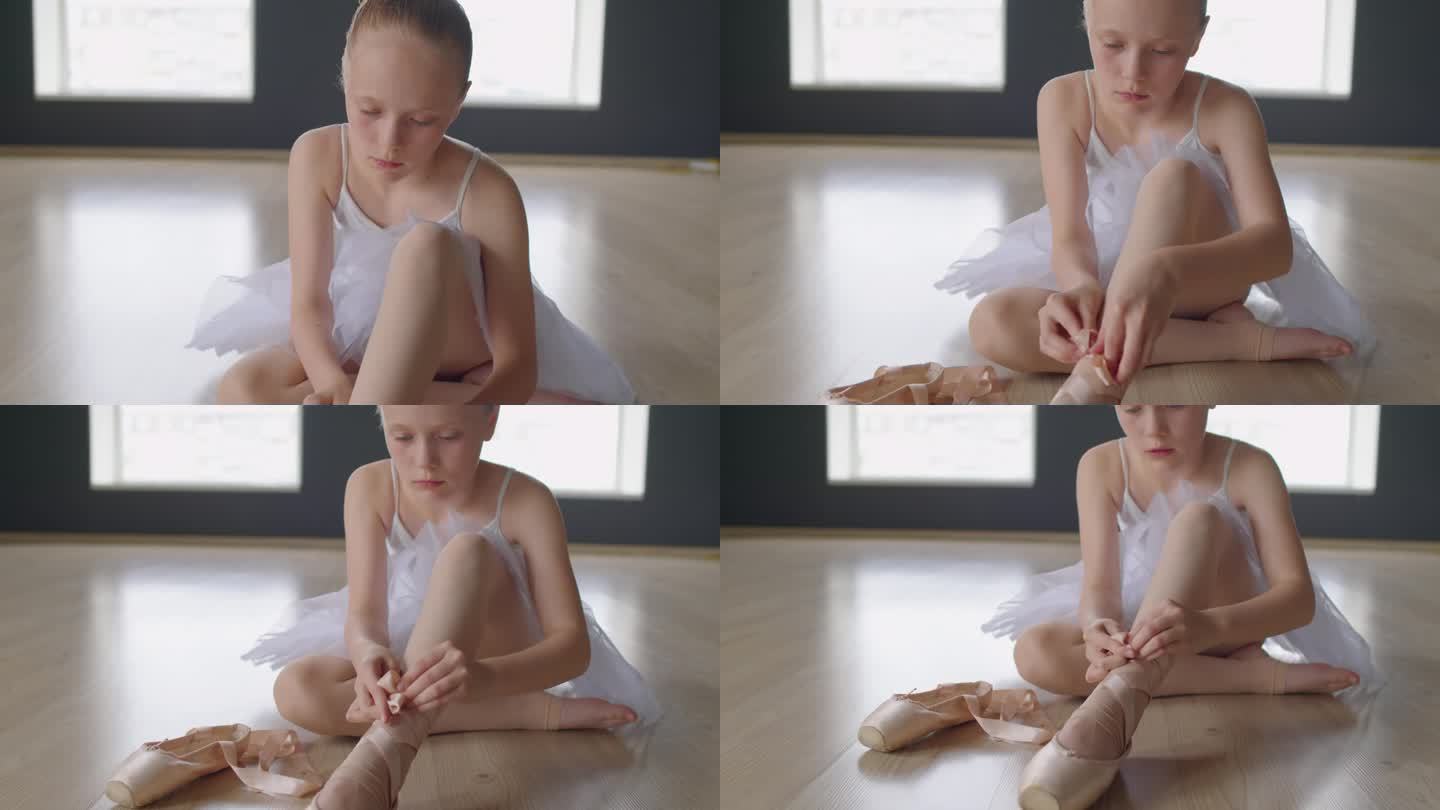 小芭蕾舞者把脚尖放在她的脚上