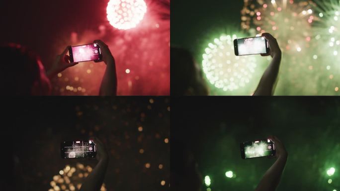 烟花和智能手机手机拍照烟花春节过年夜景元