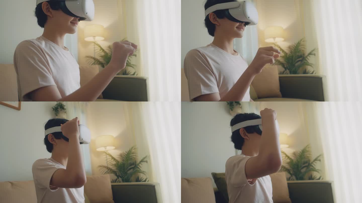 一个亚洲小男孩很开心，他戴着虚拟现实眼镜和耳机坐在客厅里玩电子游戏。