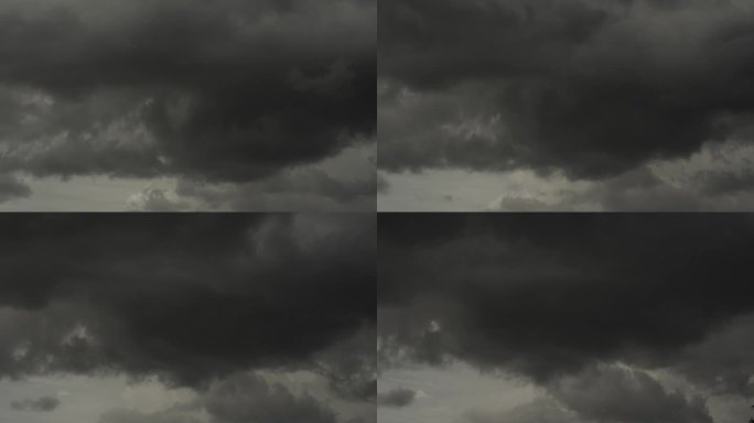 延时暗风暴云戏剧性的黑色天空背景。雷雨来临前乌云密布。气象危险，风暴气候。黑暗的云景风暴灾难时间流逝