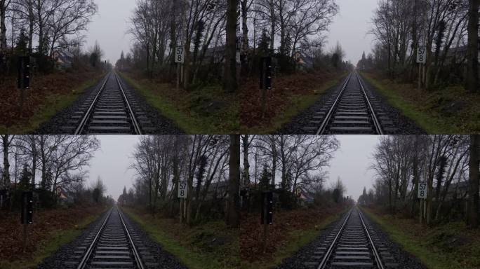 火车旅行和长途公路。火车线路和旅行计划。寒冷阴沉的道路形象。格罗诺，北威州，德国，4K