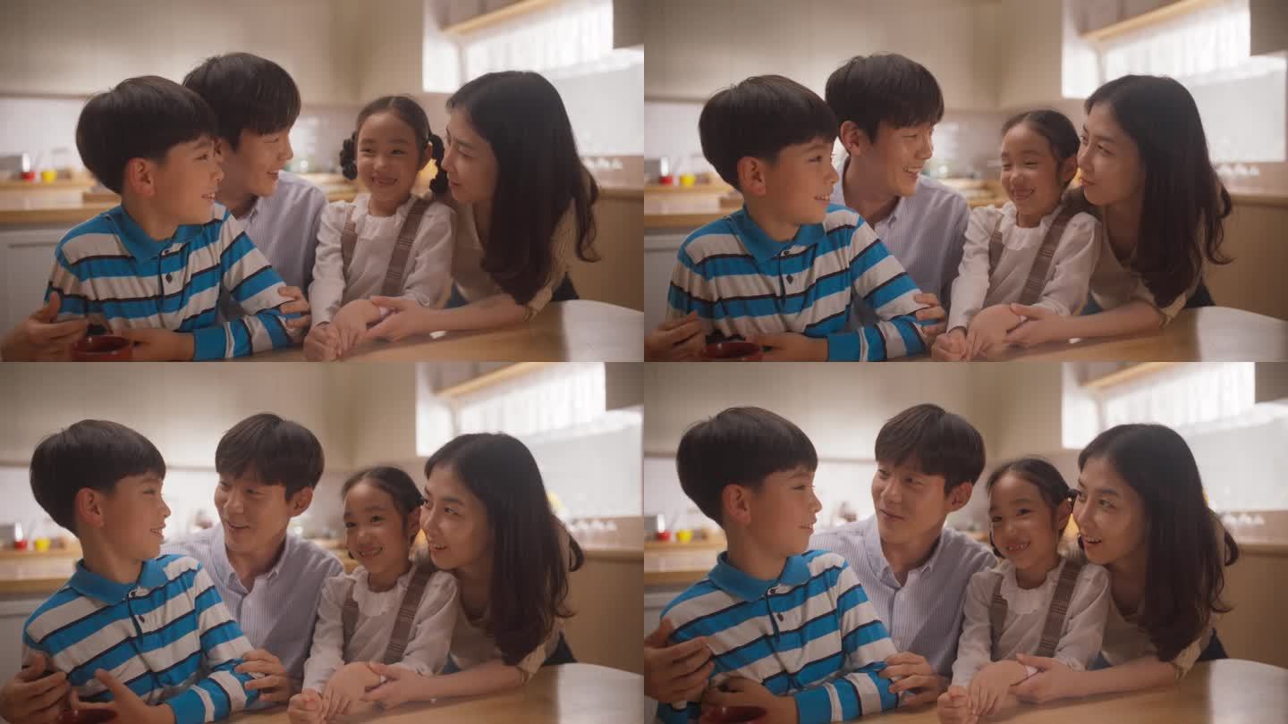 快乐的韩国小家庭在阳光明媚的家里聊天的慢动作肖像。父母与孩子沟通，对他们充满深情，认可并倾听他们