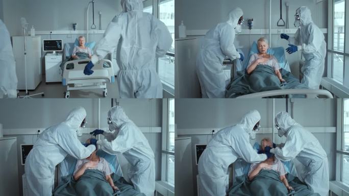 穿着个人防护服的医护人员正在检查躺在病床上戴着氧气面罩呼吸机的女病人