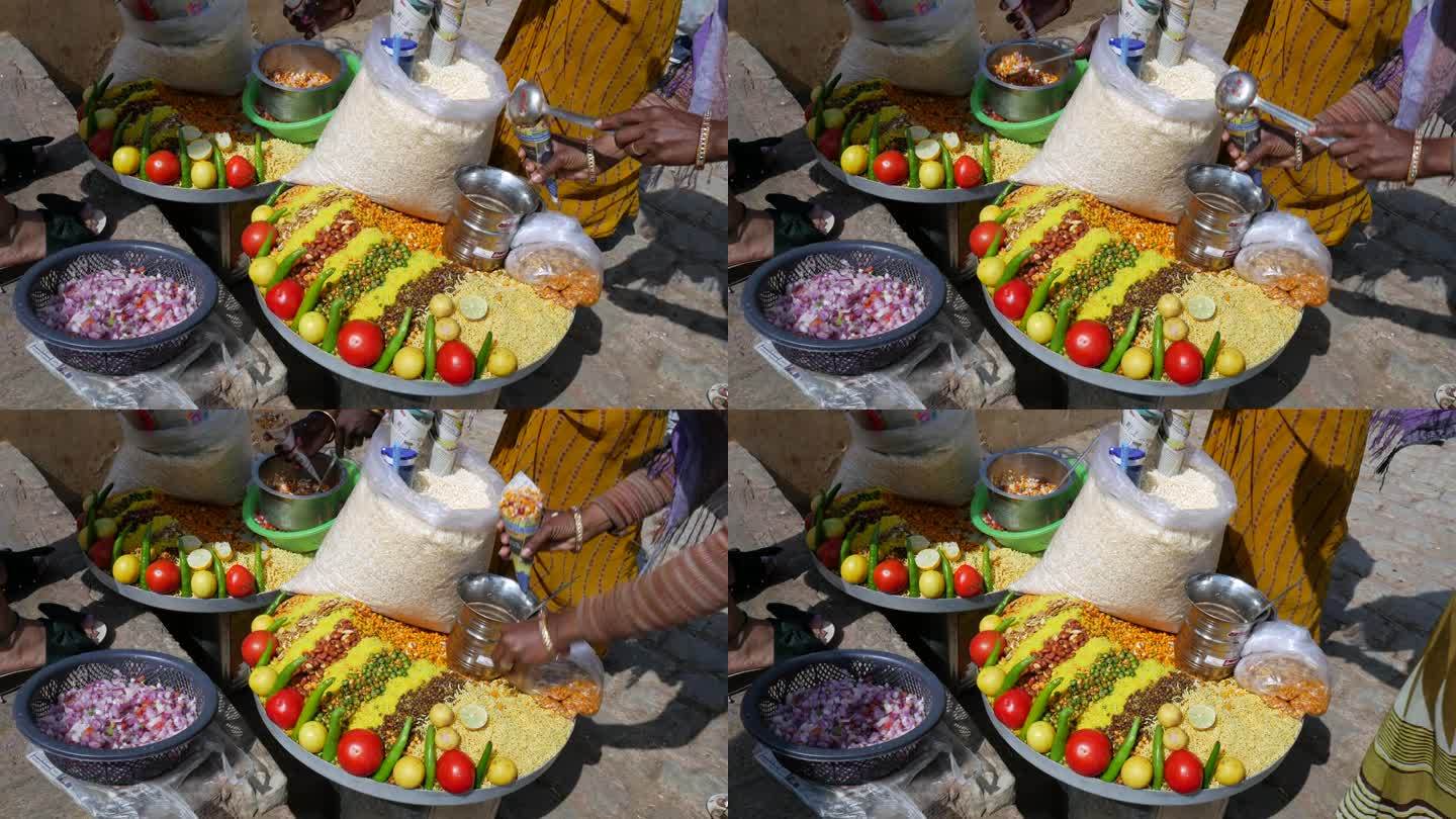 在印度拉贾斯坦邦斋浦尔的一个街头市场，小贩们在卖传统的印度街头小吃Chana Jor Garam或C