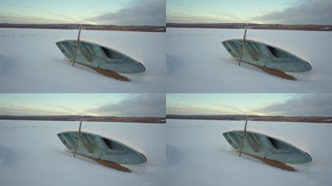 翻倒的船躺在结冰的湖面上