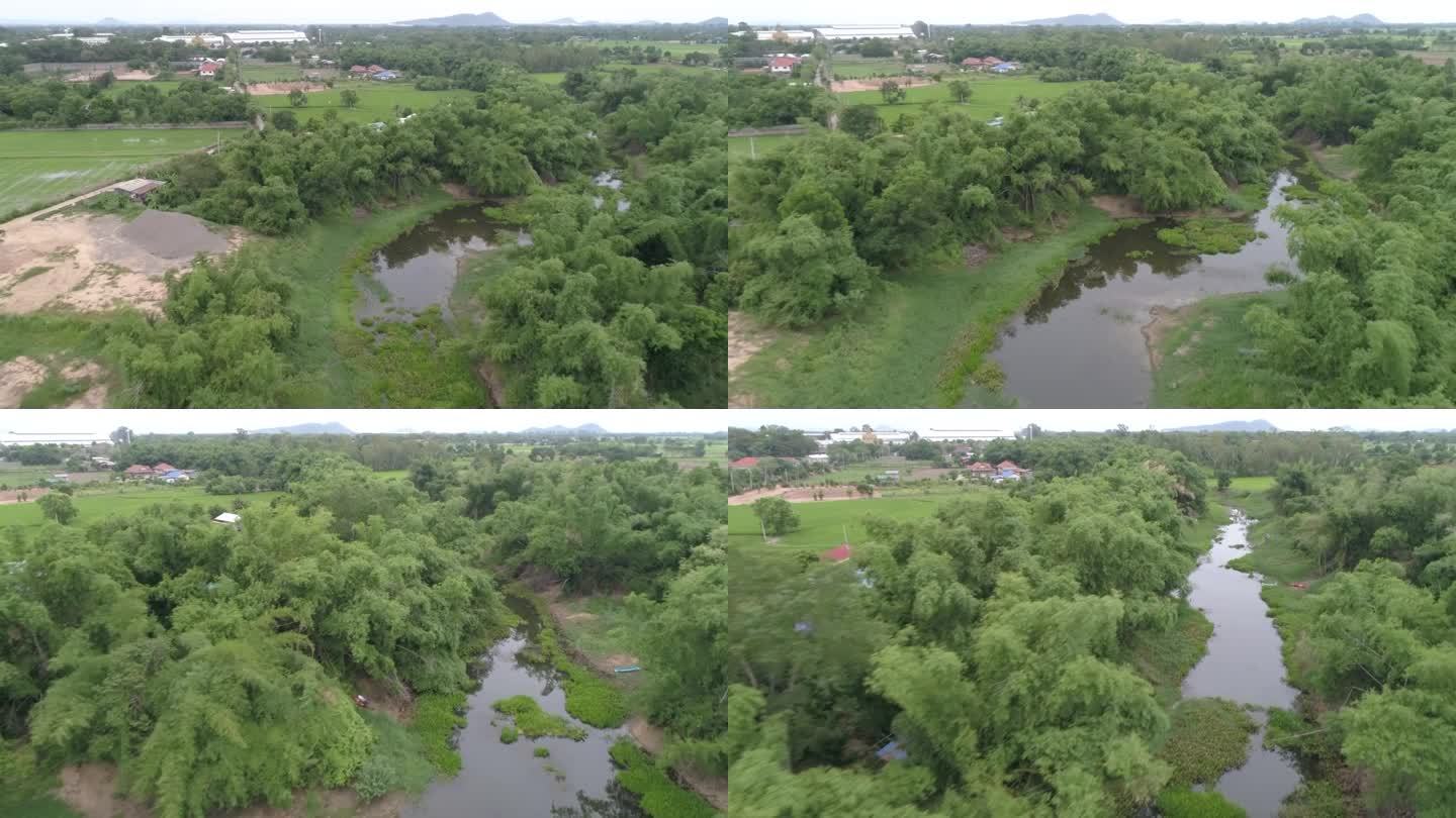 为了防止雨季的洪水，正在修建运河和大坝。日期:2021年5月14日，泰国乌泰他尼省。