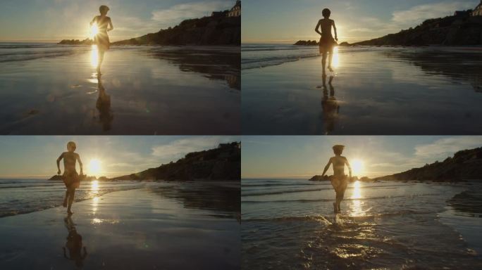 男孩在海滩上奔跑，在夕阳下的水波中戏水