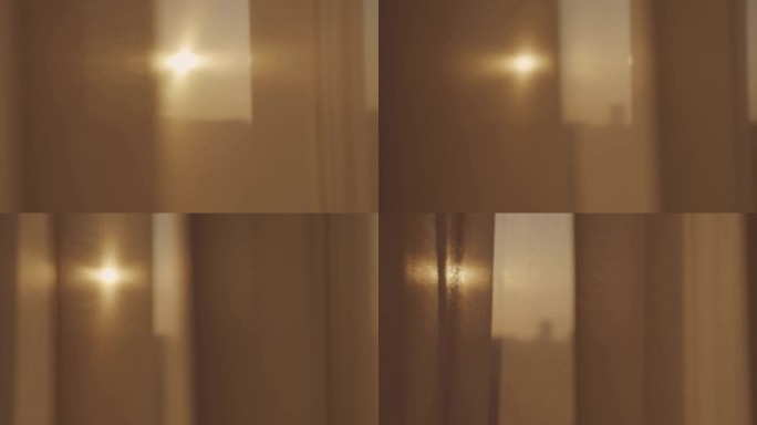 阳光透过挂在公寓窗户上的薄纱照射进来