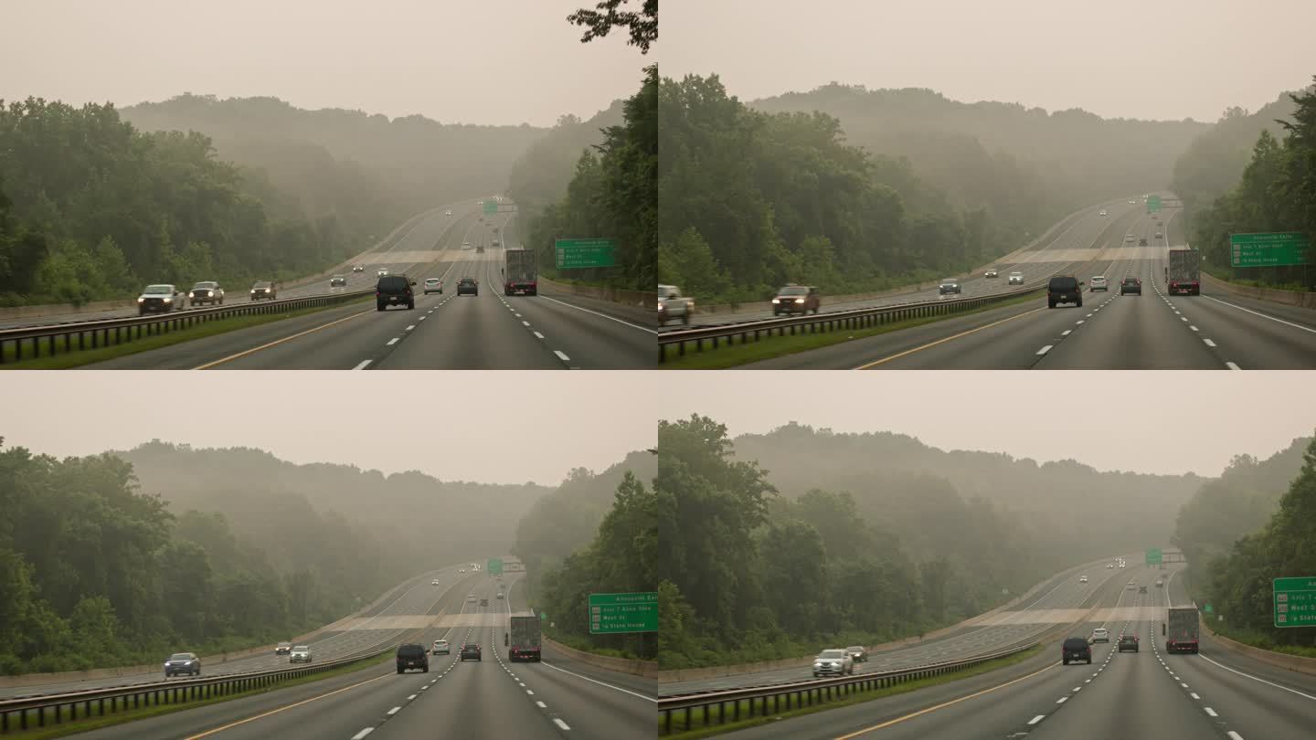 在附近大火的烟雾中自驾游。行驶在高速公路上，望向雾蒙蒙的地平线。驾驶板摄影机运动