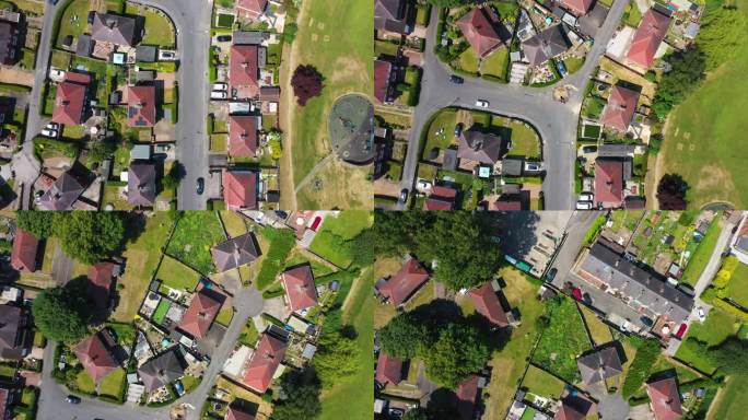 这是英国西约克郡韦克菲尔德市美丽的海姆斯沃斯小镇的航拍画面，展示了小镇周围的房屋和道路