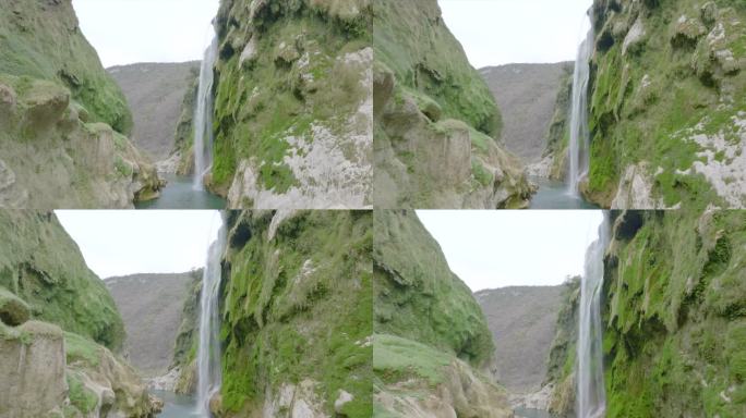 悬崖上瀑布的空中无人机视图