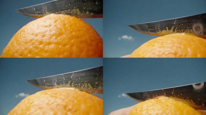 我正对着蓝天用刀切橘子。宏观，慢动作。
