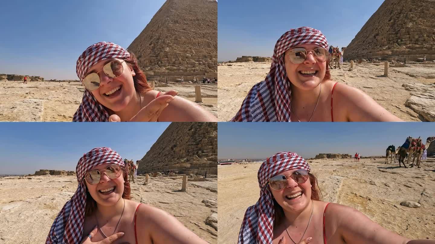 一名年轻女子在开罗吉萨金字塔前进行视频通话