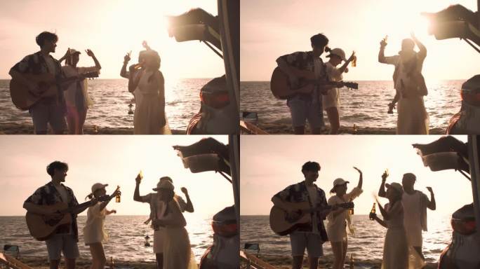 一群朋友在海边露营时载歌载舞，在海滩上享受假日假期旅行