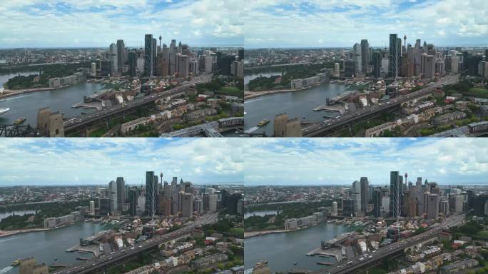 日出时悉尼中央商务区上空的4K鸟瞰图，有各种现代办公大楼和歌剧院