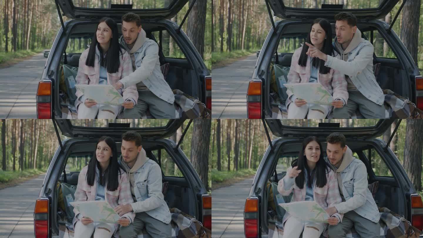 一个男人和一个女人坐在乡下的车里看着地图，指着周围，说话的慢动作肖像