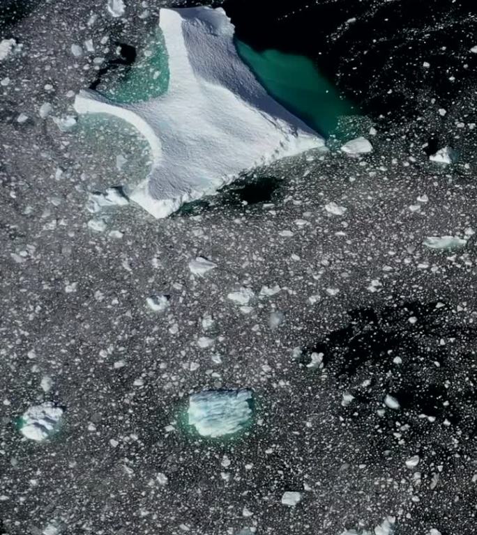 航空垂直视频关于南极洲的南极海洋漂流冰山。
