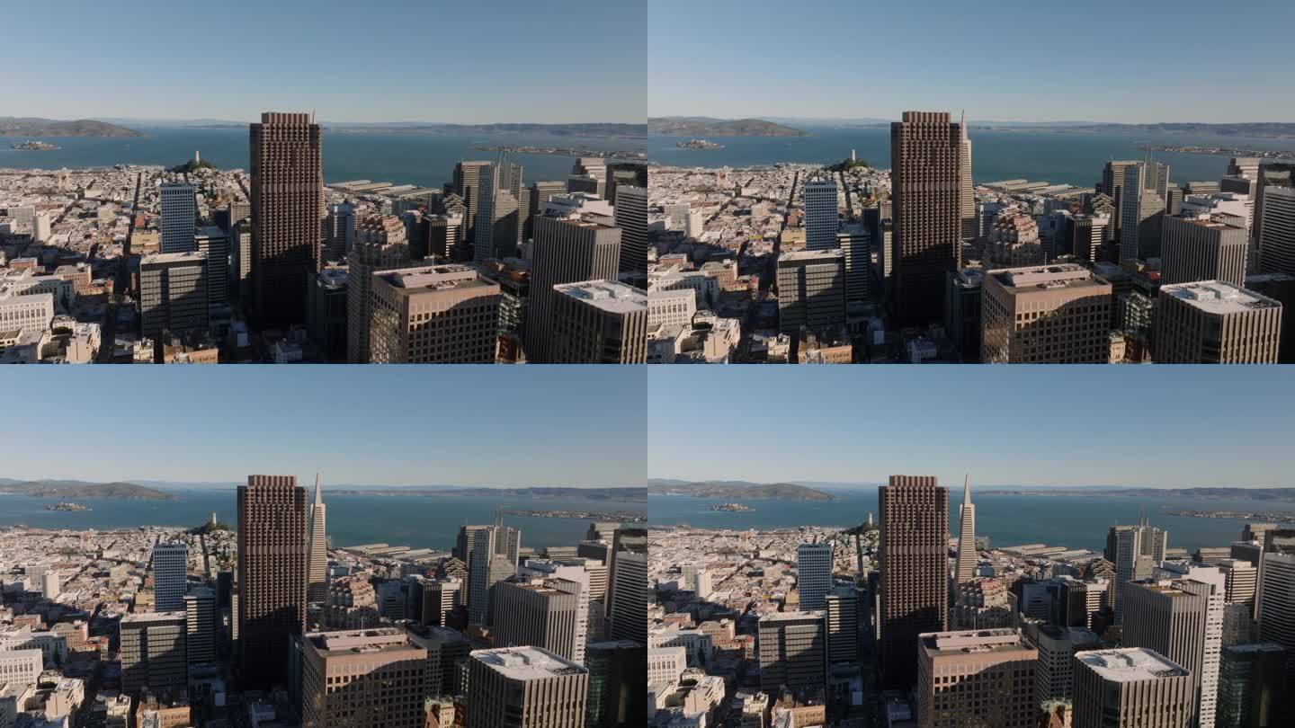 市区高楼大厦的航拍画面，背景是海湾里的水。美国加州旧金山