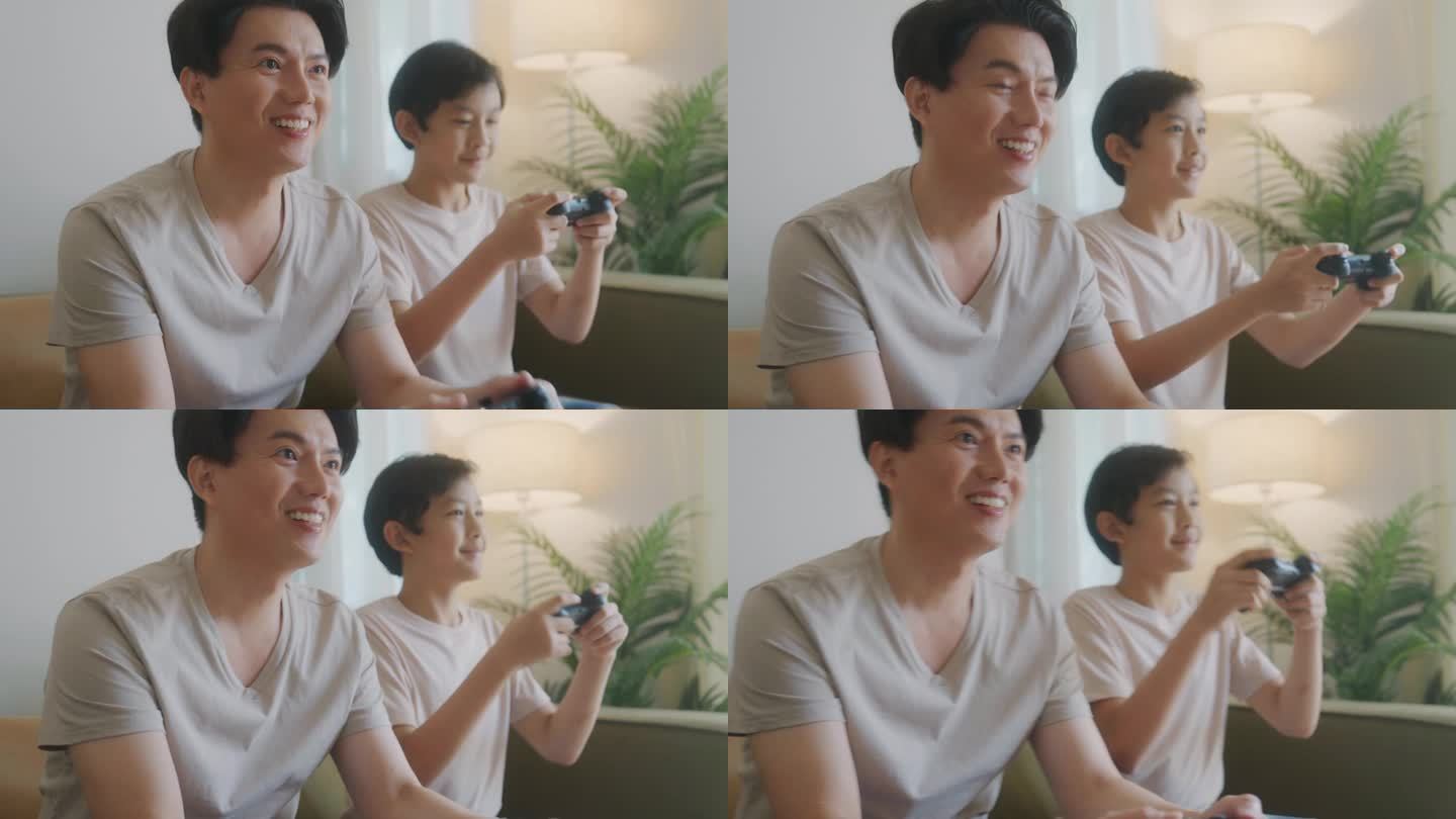 亚洲父子用操纵杆来
在家里玩电子游戏，在每个假期一起玩。