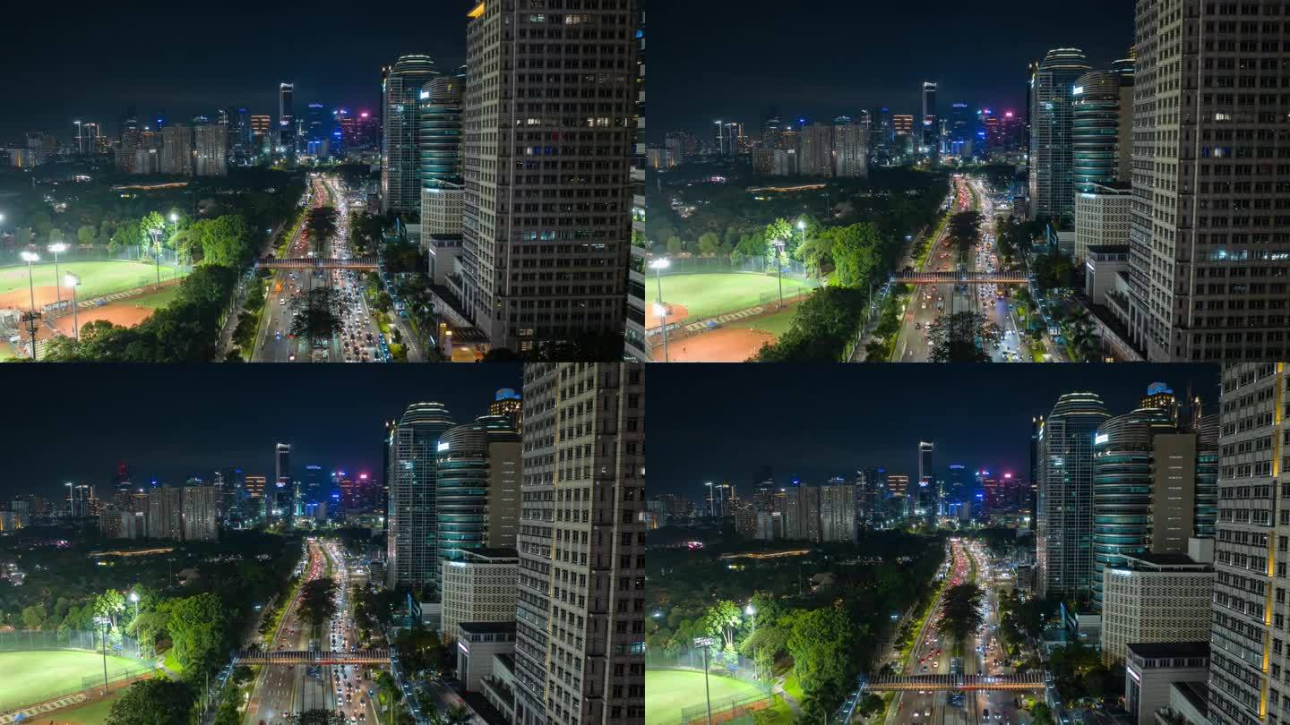 雅加达市夜间照明市中心交通街道道路工作体育场航拍全景4k延时印尼
