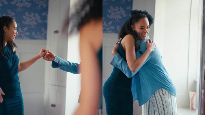 成熟的母亲在卧室里帮助十几岁的女儿准备毕业舞会的垂直视频