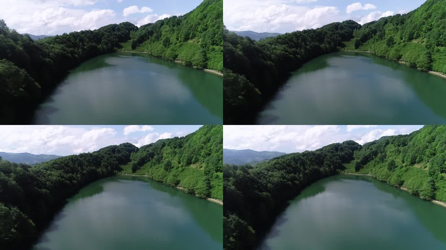 无人机拍到的山顶森林里的湖
