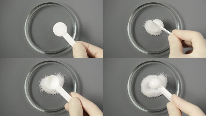 用测量勺在培养皿中取出一水葡萄糖粉末样品。d -葡萄糖或葡萄糖。天然甜味剂，代糖