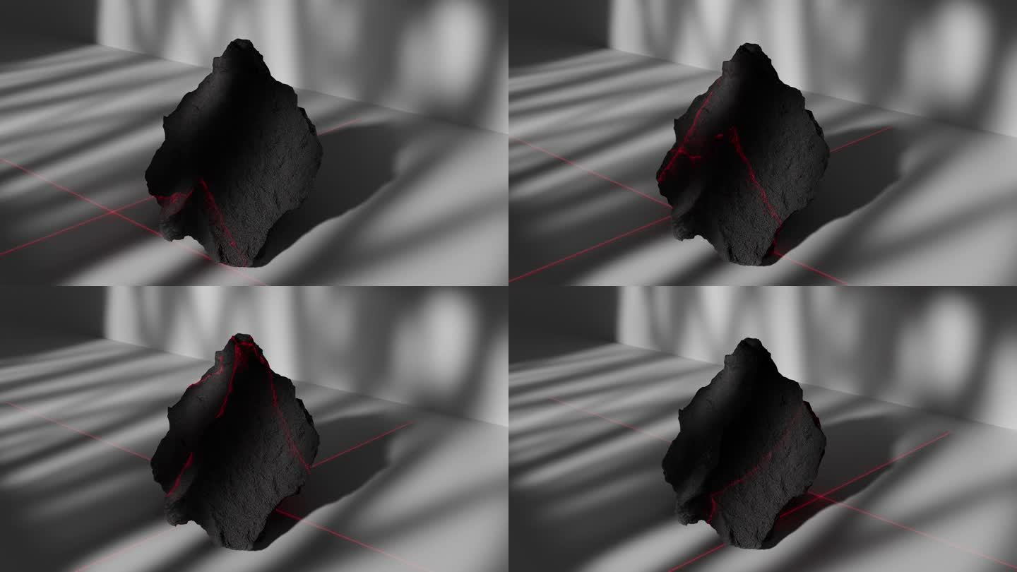 一束红色的激光扫描着一块黑色石头的表面