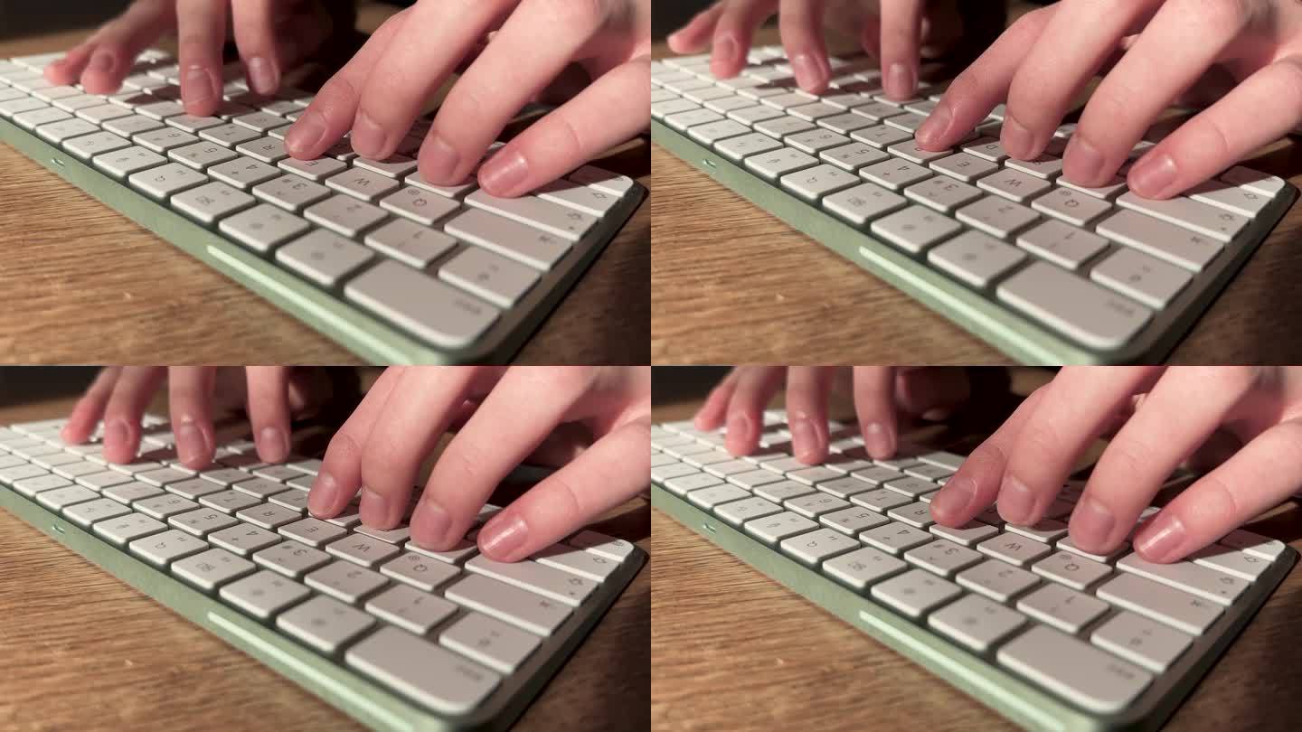 男主的手正在桌面键盘上打字，特写。