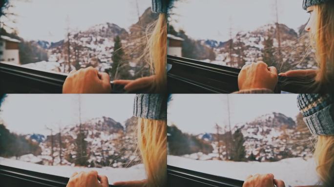 一名妇女乘火车穿过冬天的乡村