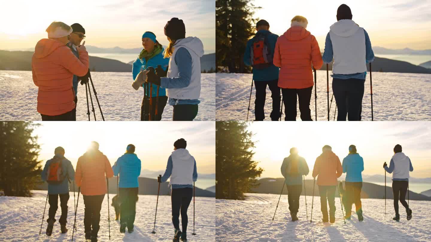 一个几代同堂的家庭在雪山上徒步旅行时，正在用智能手机查看方向