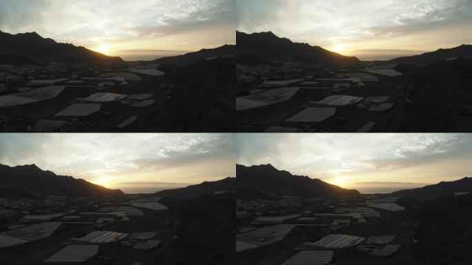 日落时分在La Aldea镇的鸟瞰图，背景是泰德火山。在大加那利岛。