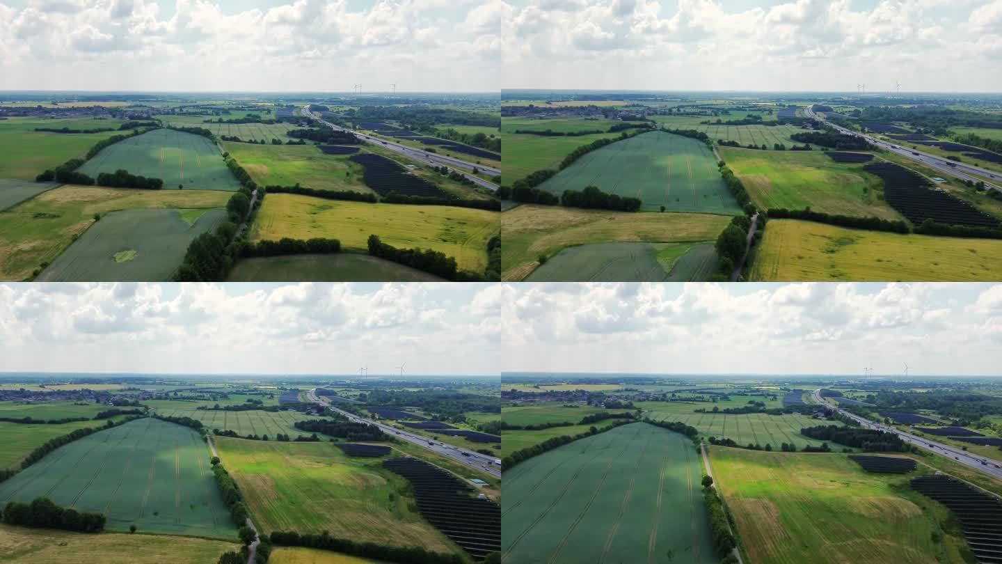 德国北部A7高速公路鸟瞰图，高速公路附近有大型太阳能电池板区域。