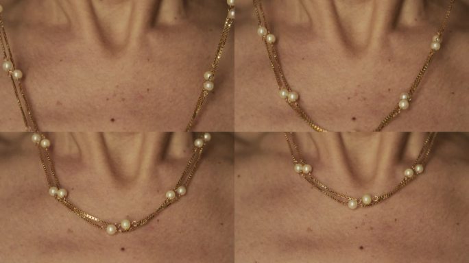 一个戴珍珠项链的女人的特写