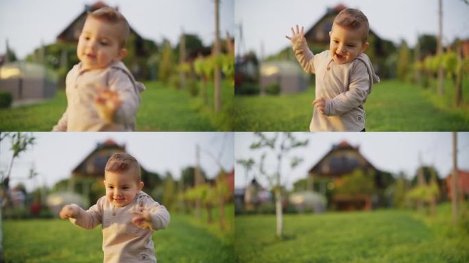 慢镜头:小男孩在草地上玩耍。15个月大的幼儿