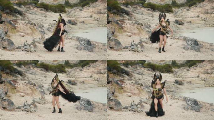 一个穿着黑色服装的女巫走在一个充满石灰岩的山谷里
