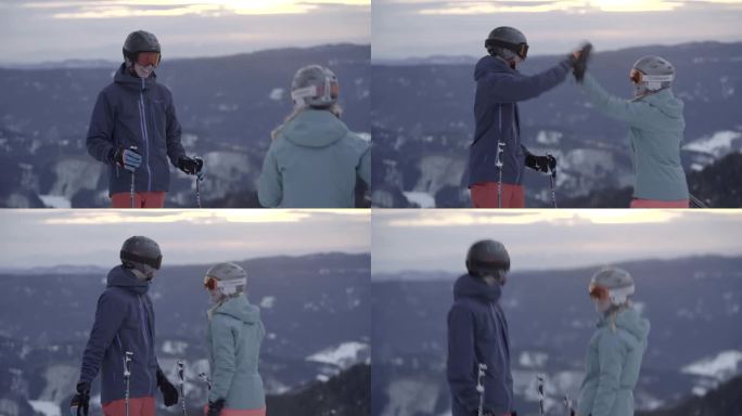 两个滑雪者在寒冷的冬日欣赏山景