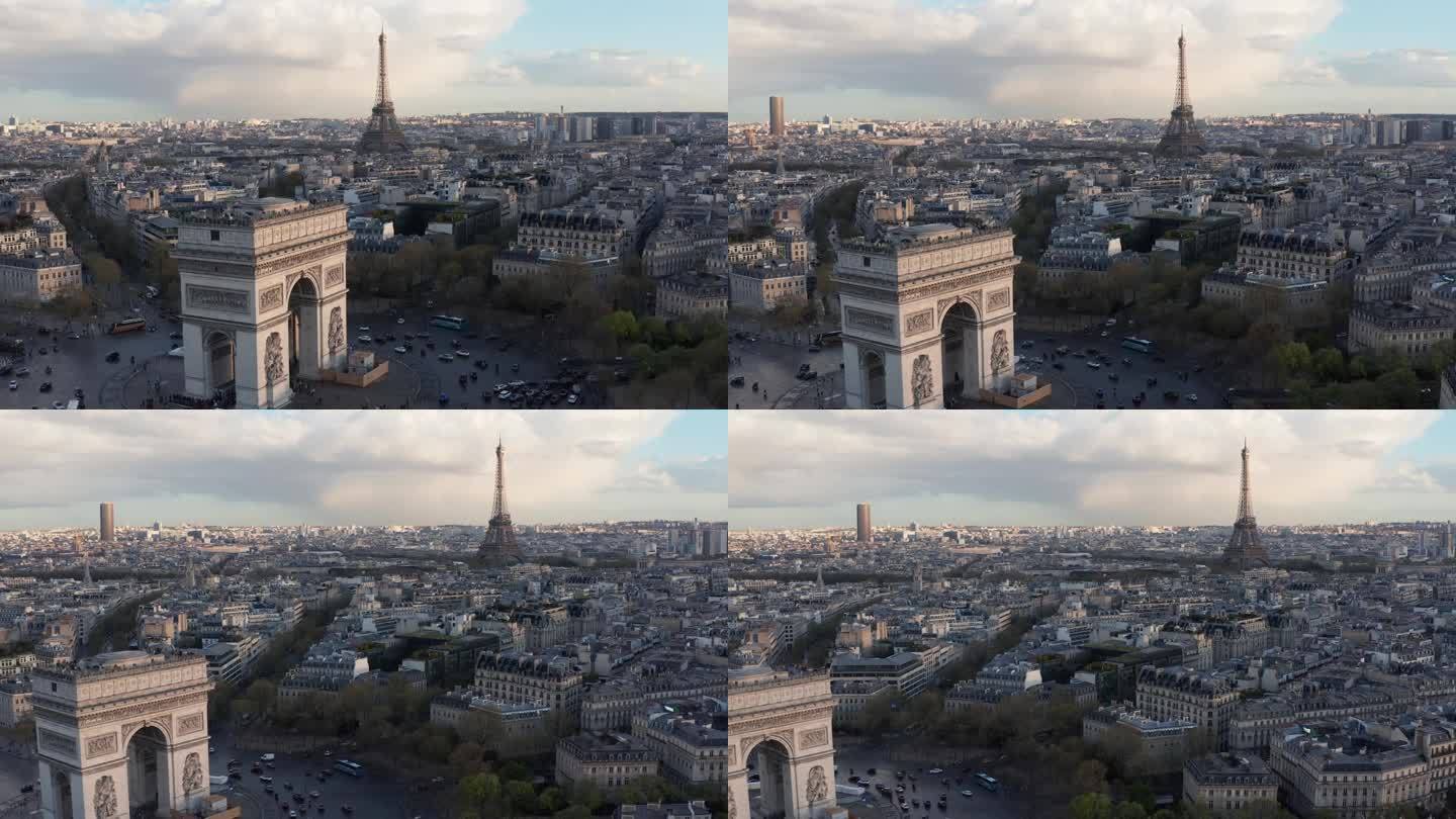 巴黎，凯旋门的前景和埃菲尔铁塔的背景。傍晚的光线，历史建筑的屋顶
