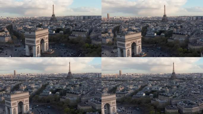 巴黎，凯旋门的前景和埃菲尔铁塔的背景。傍晚的光线，历史建筑的屋顶