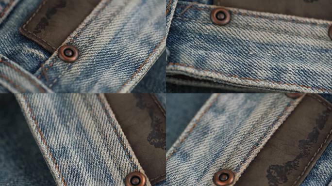 蓝色牛仔裤的旋转织物的特写细节。口袋上的铆钉和装饰补丁。