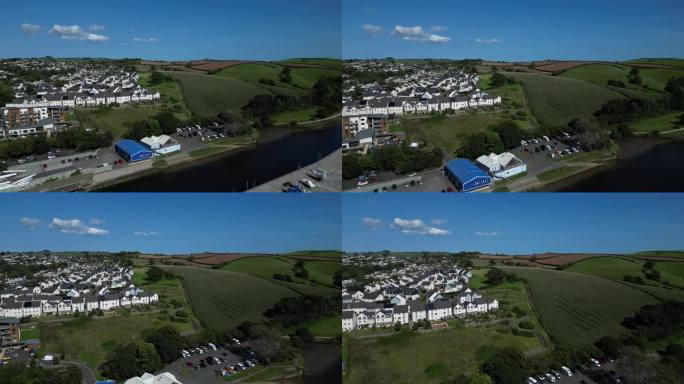 英格兰，南德文郡，托特尼斯:无人机视角:达特河，托特尼斯郊区新建的房屋和毗邻的绿地(剪辑2)