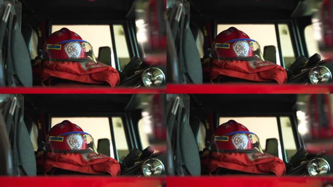 图为消防车车厢座位上的红色消防员头盔特写。多米尼加共和国的炸弹侠
