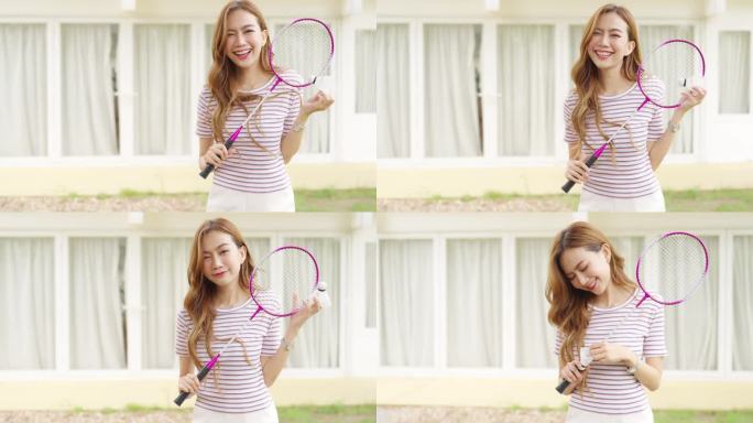 4K亚洲女性与朋友在家后院打羽毛球的肖像。