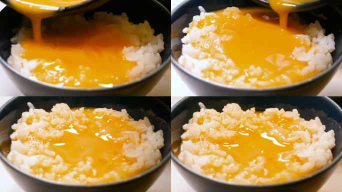 白米饭加生鸡蛋。一个把生鸡蛋放在新鲜煮熟的米饭上的视频。