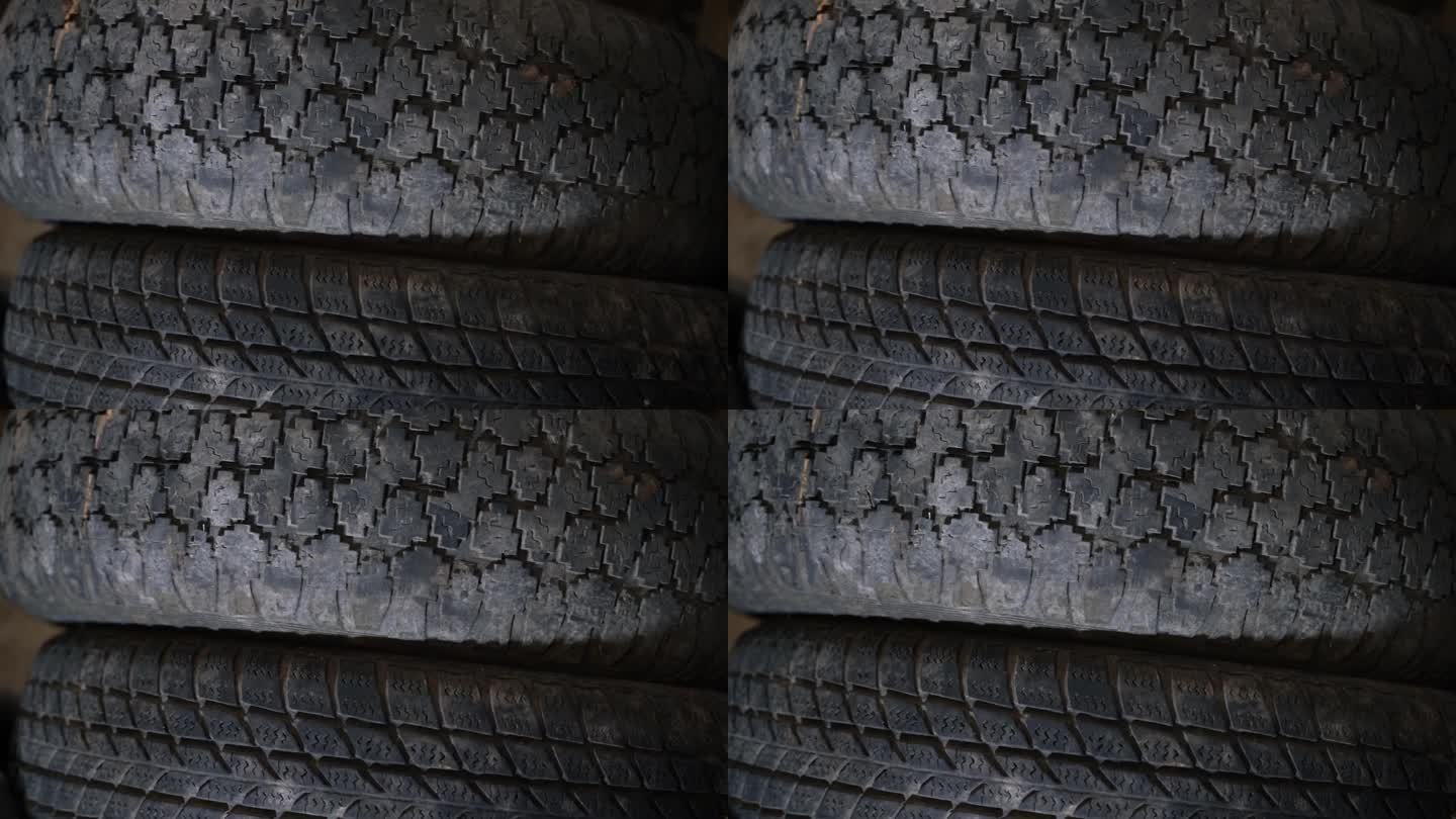 两个不同花纹的旧汽车轮胎。硬胎和路胎的区别