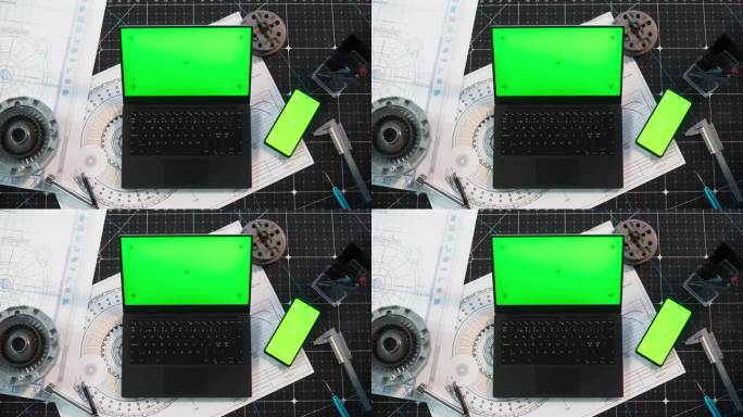 从上到下，一台笔记本电脑模拟绿屏站在工业办公桌上，旁边是一台带有模板Chromakey显示屏的智能手