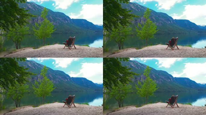 田园诗般的湖前，岩石上的一张椅子